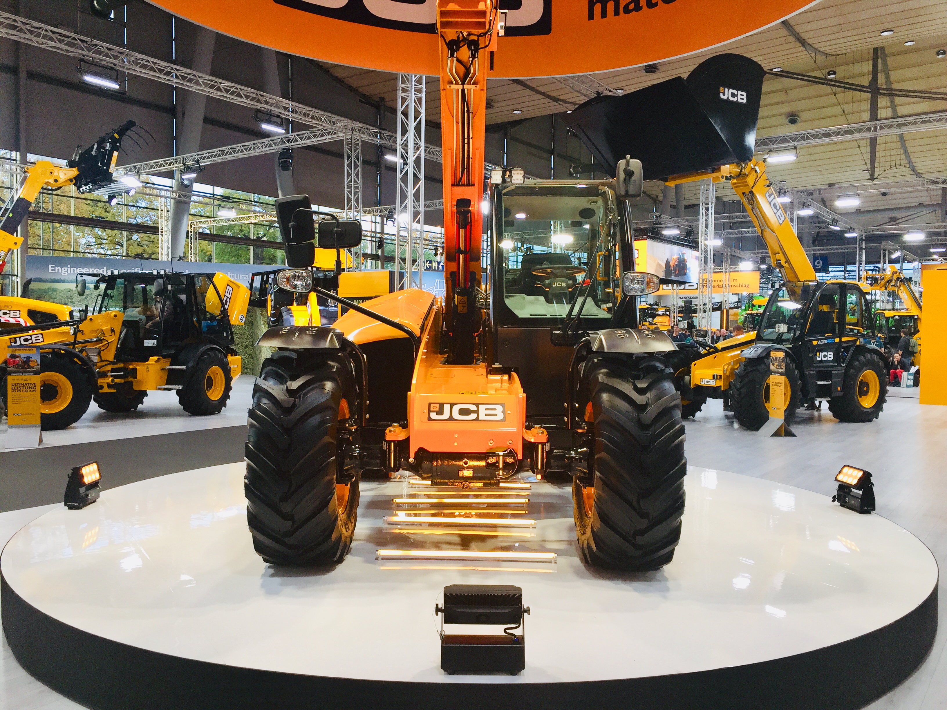 JCB on a revolving stage display at and exhibition.